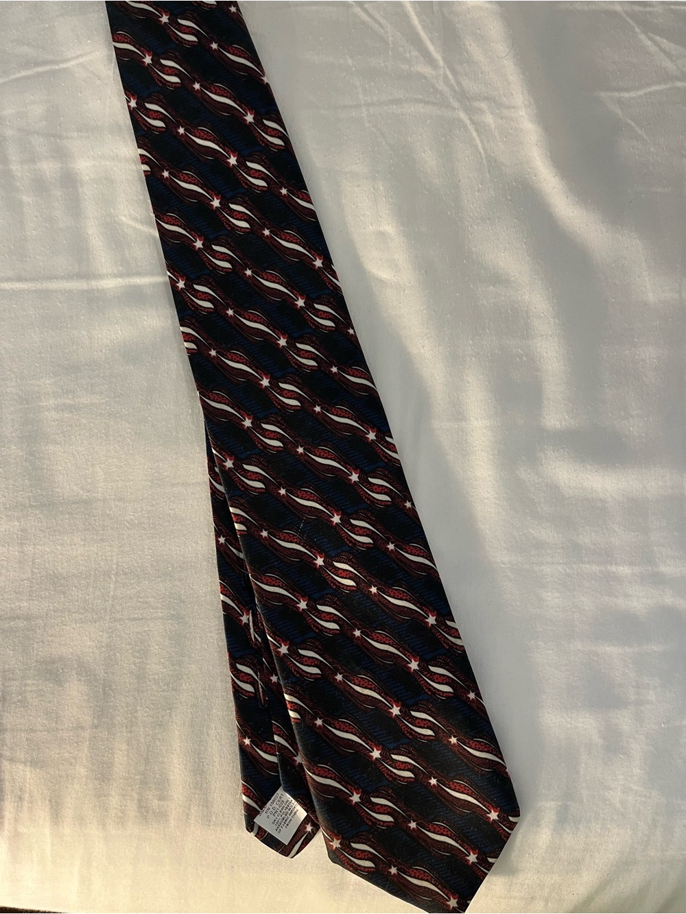 Classic Men's Navy Tie with Red and White Pattern